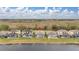 Aerial view of houses with pools and a lake at 2983 Sunset Vista Blvd, Kissimmee, FL 34747