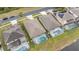 Aerial view of screened pools in a lakeside neighborhood at 2983 Sunset Vista Blvd, Kissimmee, FL 34747