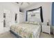 Comfortable bedroom with carpeted floors, woven furniture, and ensuite bath at 2983 Sunset Vista Blvd, Kissimmee, FL 34747