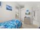Bright bedroom with a twin bed, neutral walls, a TV, and access to an en-suite bathroom at 2983 Sunset Vista Blvd, Kissimmee, FL 34747