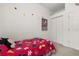 bedroom with twin bed, closet, and Mickey Mouse decor at 2983 Sunset Vista Blvd, Kissimmee, FL 34747