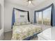 King-size bedroom with tropical bedding and window seating at 2983 Sunset Vista Blvd, Kissimmee, FL 34747
