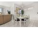 Elegant dining area with white furniture, chandelier, and views of the backyard at 2983 Sunset Vista Blvd, Kissimmee, FL 34747
