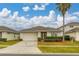 Single-story home with attached garage and landscaped lawn at 2983 Sunset Vista Blvd, Kissimmee, FL 34747