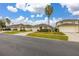 Residential home on a tree-lined street with manicured lawns at 2983 Sunset Vista Blvd, Kissimmee, FL 34747