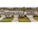 Charming single-story home featuring a well-manicured lawn and beautiful lake view at 2983 Sunset Vista Blvd, Kissimmee, FL 34747
