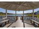 Wooden gazebo overlooking a peaceful lake at 2983 Sunset Vista Blvd, Kissimmee, FL 34747