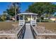 White gazebo and wooden dock near lake at 2983 Sunset Vista Blvd, Kissimmee, FL 34747