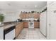 Functional kitchen with ample cabinet space and white appliances at 2983 Sunset Vista Blvd, Kissimmee, FL 34747