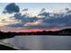 Sunset over lake with houses in the background at 2983 Sunset Vista Blvd, Kissimmee, FL 34747