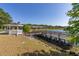 White gazebo with lake access and wooden dock at 2983 Sunset Vista Blvd, Kissimmee, FL 34747