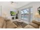 Relaxing living room space with a view of the pool and lake at 2983 Sunset Vista Blvd, Kissimmee, FL 34747
