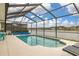 Screened pool with lake view, perfect for relaxing and entertaining with a view at 2983 Sunset Vista Blvd, Kissimmee, FL 34747