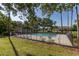Fenced community pool featuring ample seating and shade at 2983 Sunset Vista Blvd, Kissimmee, FL 34747