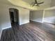 Spacious bedroom with tray ceiling, wood flooring, and neutral paint at 3213 Holderness Dr, Kissimmee, FL 34741