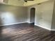 Spacious bedroom with wood flooring and neutral paint at 3213 Holderness Dr, Kissimmee, FL 34741