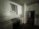 Modern kitchen with stainless steel appliances, white cabinets, and backsplash at 3213 Holderness Dr, Kissimmee, FL 34741
