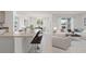 Open kitchen with granite countertops and island seating at 3510 Sandalwood Isle Way, Ocoee, FL 34761