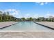 Community swimming pool with surrounding patio at 3510 Sandalwood Isle Way, Ocoee, FL 34761