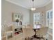 Dining room with a stylish chandelier, neutral paint, and a full view of the backyard at 3525 Belland Cir # A, Clermont, FL 34711
