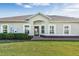 Charming home featuring a neatly landscaped lawn and a welcoming front entrance with lovely architectural detail at 3525 Belland Cir # A, Clermont, FL 34711