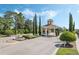 Elegant guard house with lush landscaping, providing a secure and welcoming entrance to the gated community at 3525 Belland Cir # A, Clermont, FL 34711