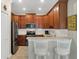 Well-equipped kitchen featuring stainless steel appliances, a breakfast bar, and ample cabinet space at 3525 Belland Cir # A, Clermont, FL 34711