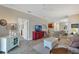 Spacious living room features neutral colors, tile floors, an open floor plan, and lots of natural light at 3525 Belland Cir # A, Clermont, FL 34711