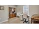 Bright office featuring a hutch, sewing table, and natural light from the window with plantation shutters at 3525 Belland Cir # A, Clermont, FL 34711