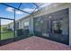 Screened in brick patio offers a shady outdoor living space at 3525 Belland Cir # A, Clermont, FL 34711
