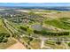 Expansive aerial view of the community highlighting the pond, community center, and lush green spaces at 3541 Belland Cir # A, Clermont, FL 34711