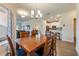 Charming dining area with a wooden table, seamlessly connected to the kitchen and living spaces at 3541 Belland Cir # A, Clermont, FL 34711