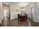 Elegant dining area with a chandelier and a seamless flow to the living room at 3541 Belland Cir # A, Clermont, FL 34711