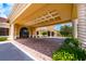 Stunning entrance to the clubhouse with covered portico, grand columns, and lush landscaping at 3541 Belland Cir # A, Clermont, FL 34711