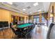Entertainment room with a poker table, chairs, and a serving bar at 3541 Belland Cir # A, Clermont, FL 34711