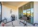 Covered patio with a grill, wicker chairs, and a view of the backyard at 3541 Belland Cir # A, Clermont, FL 34711