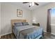 Relaxing bedroom with hardwood floors, a queen bed, and soft lighting for a restful atmosphere at 3610 Charmed Ln, St Cloud, FL 34772