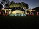 Nighttime image of the Esprit community entrance sign, decorated with snowman figures and holiday lights at 3610 Charmed Ln, St Cloud, FL 34772