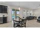 Dining area featuring a sliding glass door that leads to a pool and a view of the backyard at 3610 Charmed Ln, St Cloud, FL 34772