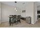 A dining room with a modern table set and stylish pendant lighting at 3610 Charmed Ln, St Cloud, FL 34772