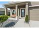 Inviting front porch with a decorative bench, complemented by manicured landscaping at 3610 Charmed Ln, St Cloud, FL 34772