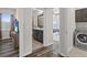 A view of the interior of a home, with partial views of bathroom, laundry, and bedroom spaces at 3610 Charmed Ln, St Cloud, FL 34772