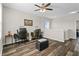 Upstairs loft area featuring wood flooring, a ceiling fan and two desks for a home office at 3610 Charmed Ln, St Cloud, FL 34772