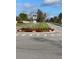 Well-maintained streetscape with a landscaped traffic circle and surrounding homes at 3610 Charmed Ln, St Cloud, FL 34772