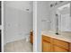 Bright bathroom features tiled floors, a vanity, and a mirror with overhead lighting at 4004 Santa Maria Dr # 105, Kissimmee, FL 34741