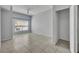 Bright bedroom features tiled floors, a ceiling fan, natural light, and a closet for ample storage at 4004 Santa Maria Dr # 105, Kissimmee, FL 34741