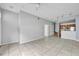 Inviting living room featuring sleek tile flooring, an open layout, and stairs leading to the upper level at 4004 Santa Maria Dr # 105, Kissimmee, FL 34741