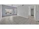 Spacious living room with tile flooring and large window, offering an abundance of natural light and a welcoming atmosphere at 4004 Santa Maria Dr # 105, Kissimmee, FL 34741