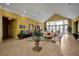 Inviting clubhouse lobby with seating, lush plants and information center, perfect for gatherings and community events at 4004 Santa Maria Dr # 105, Kissimmee, FL 34741