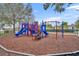 Vibrant community playground featuring slides, climbing structures, and a soft landing surface for safe and fun play at 4004 Santa Maria Dr # 105, Kissimmee, FL 34741